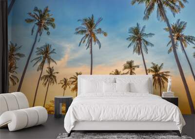 Sunset with palm trees with sunset sky, landscape of palms on island Wall mural