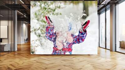 Girl throws snow Wall mural