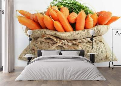 Fresh carrots harvested and presented in a rustic burlap sack with green tops, ready for market display Wall mural