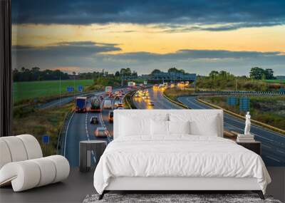 Colorful sunset at M1 motorway near Flitwick junction with blurry cars in United Kingdom Wall mural