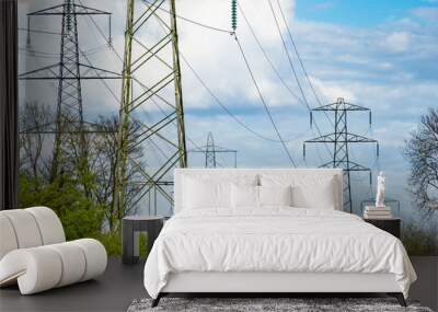 High Voltage electric towers against blue sky Wall mural