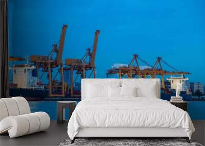 Container loading by crane, cargo ship at shipping port at twilight, Logistics and transportation concept Wall mural