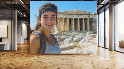 Young female tourist looking at Parthenon Athens greece temple Wall mural