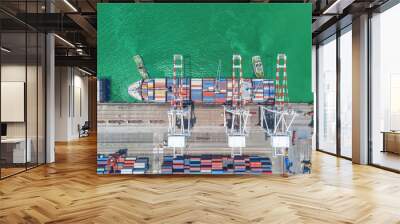 Aerial top view Tugboat drag Container Ship at sea port or Container warehouse and working crane bridge for load Container. Logistics, import export, shipping or transportation. Wall mural