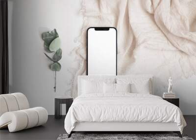 phone with eucalyptus branch on  scarf Wall mural