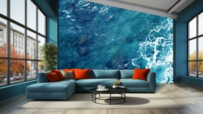 Aerial view of the ocean water surface and waves. Beautiful water background texture for tourism and advertising. Tropical coast Wall mural