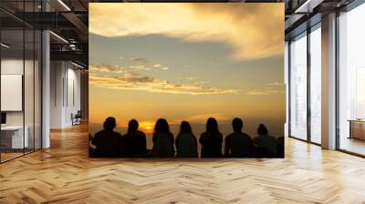 Group of people looking at sunset Wall mural