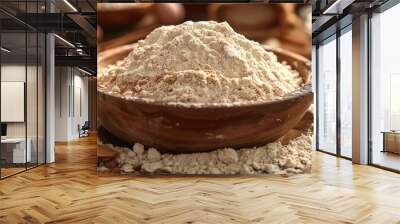 A rustic kitchen scene featuring bowls of almond flour on a wooden table, surrounded by almonds and cooking utensils. Wall mural