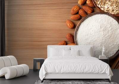 Almond flour with oats and almonds on wood background, healthy cooking ingredients. Wall mural