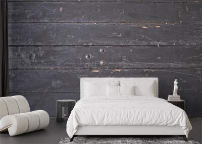 Weathered rustic and grungy black plank from table in top view Wall mural