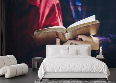 A couple  reading and study bible in home and pray together.Christian concept. Wall mural