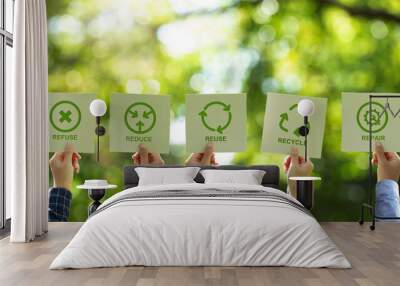 a group of businessmen's hands holding a brown recycled paper card with 5r sign and icon. recycle, r Wall mural