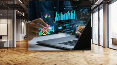 Businessman works on laptop Showing 2024 business trends dashboard with charts, metrics,  AI, E-commerce, KPI. analytical businessperson planning business growth 2024. New Year Future business tech. Wall mural