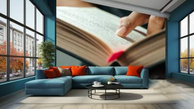 close-up of finger pointing text in Bible.close up of man reading through the Bible. Wall mural