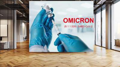 Covid-19 Omicron vaccine concept.New COVID-19 variant a medical syringe in Doctor's hand and Omicron (B.1.1.529): SARS-CoV-2 words in the hospital background. Omicron coronavirus variant. Wall mural