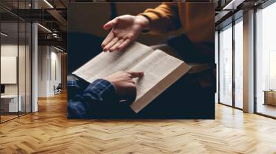 Male reading the Holy Bible by pointing to the character and sharing the gospel with a friend. Holy Bible study reading together in Sunday school.Studying the Word Of God With Friends. Wall mural