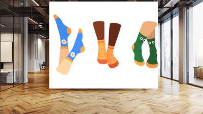 Pairs of feet in socks set. Vector illustrations of female and male underwear. Cartoon warm wool or cotton clothes for legs with funny pattern isolated on white. Accessory, footwear, fashion concept Wall mural