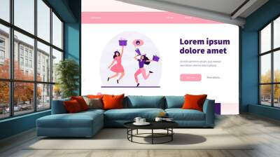 Two cheerful women celebrating and jumping with gifts. Present, loudspeaker, fun flat vector illustration. Promotion and advertising concept for banner, website design or landing web page Wall mural