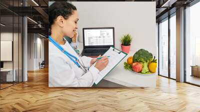 Nutritionist creates personalized meal plan for her patient. Vegetables and fruits for a healthy diet Wall mural