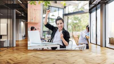 Successful business woman with arms up,Asian Business woman with casual suit working with happy action in the Office or coffee shop. Wall mural