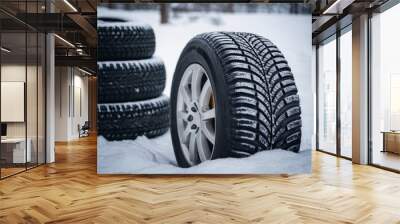 Winter tire with detail of car tires in winter snowy season on the road covered with snow Wall mural