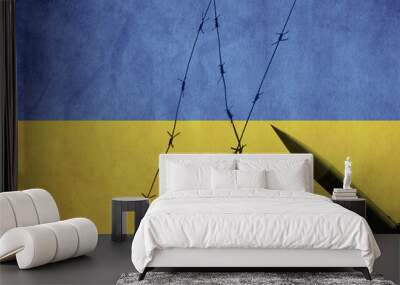 Flag of Ukraine painted on a concrete wall with wire fence and missiles. Relationship between Ukraine and Russia  Wall mural