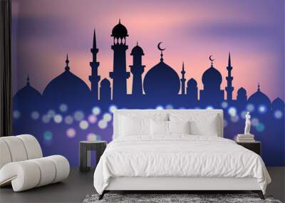 Mosque silhouette in sunset sky and candles light for ramadan of Islam Wall mural