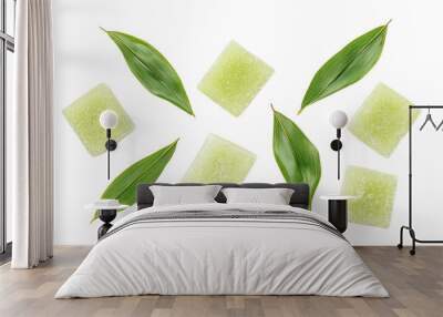 Stylish arrangement of green herbal cubes and fresh leaves, perfect for wellness and spa themed projects. Wall mural