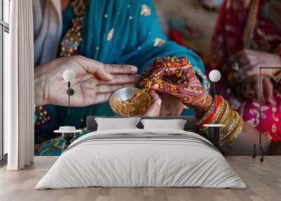 A woman is applying henna to another woman's hand,Eid-al-Adha, the Feast of Sacrifice. Wall mural