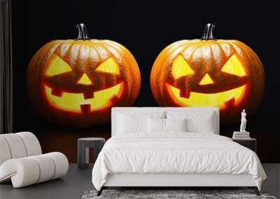 Two glowing jack-o'-lanterns on a dark background, showcasing playful Halloween faces, perfect for seasonal decor. Wall mural