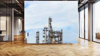 Industrial of oil refinery plant from industry zone ,Refinery factory oil storage tank and pipeline steel with blue sky. Wall mural