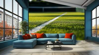 A close-up of the lush green grass of a tennis court, perfectly trimmed for an upcoming tournament, with the sharp contrast of white lines guiding the eye across the smooth playing surface. Wall mural