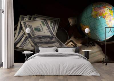 Balancing with money and earth. Wall mural