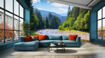 nature scenery with mountain river. green environment background with stones on the shore and forested hills Wall mural