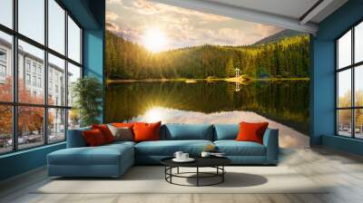 tranquil landscape with lake in summer at sunset. forest reflection in the calm water. scenic travel background. green outdoor nature scene in evening light Wall mural