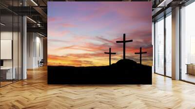 three crosses in silhouette on a hill with sunset Wall mural