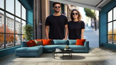 A couple boyfriend and girlfriend wearing blank black matching t-shirts mockup for design template Wall mural