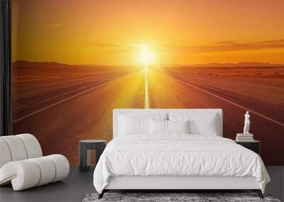 A long road leading into the distance, with an orange sunset in the empty highway background. Wall mural