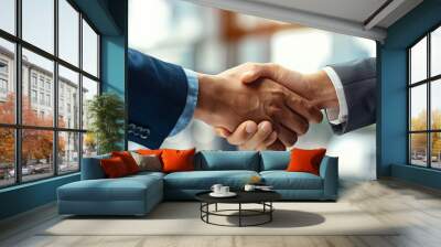 Businessmen shaking hands in a successful partnership agreement on blur office background. Wall mural