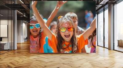 Excited children playing and laughing together outdoors in the summer Wall mural