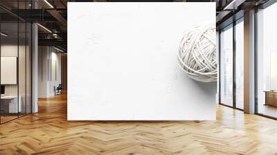 White Yarn Ball on a Cracked White Surface Wall mural