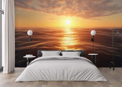 A beautiful sunset over the ocean with the sun setting behind the horizon. Wall mural