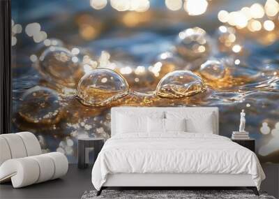 Closeup of water bubbles with sun glare. Wall mural