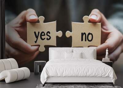 Two hands holding puzzle pieces with the words 'yes' and 'no' written on them. Wall mural