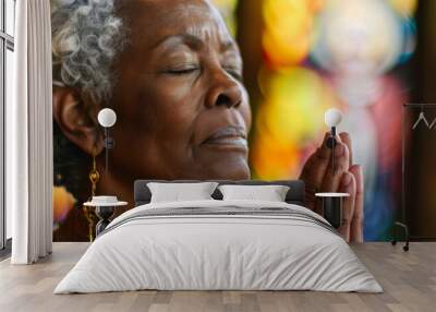 Black woman, pray and hands in church with eyes closed, Sunday service and Christian believer in prayer to God. Jesus, worship and gratitude or repentance for faith belief, spirituality and healing Wall mural