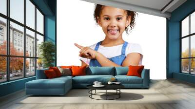 A cute little girl pointing sideways towards copyspace. Happy and cute kid showing or endorsing company or product isolated on a png background Wall mural