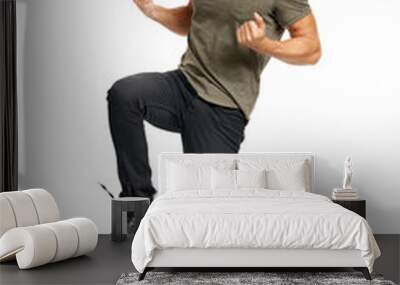 A handsome young man jumping with excitement Isolated on a PNG background. Wall mural