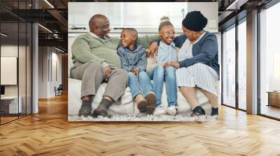 African, conversation and smile with family on sofa in living room of home together for bonding. Happy, love or visit with senior grandparents and sibling children in apartment for growth or wellness Wall mural