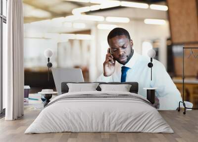 African man, phone call and laptop as manager, employee and accountant in finance company. Male person, tech and notes for investment, project or portfolio for tax review, development and opportunity Wall mural