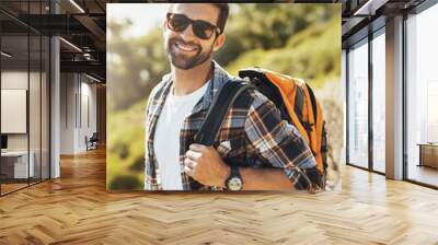 Backpack, nature and man hiking on vacation for adventure, travel or journey with smile in New Zealand. Happy, sunglasses and male person trekking on outdoor trail or path on holiday or weekend trip. Wall mural